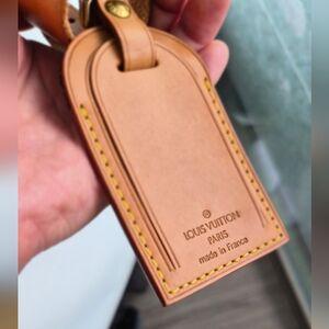 Authentic Louis Vuitton luggage tag and Bracelet set with small dust bag.